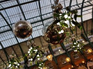 The former market halls at Covent Garden get decorated with huge baubles
